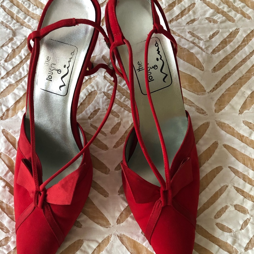 Red suede with ribbon design .